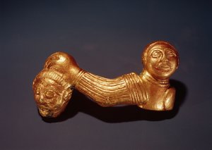 Pin with a warrior holding a head